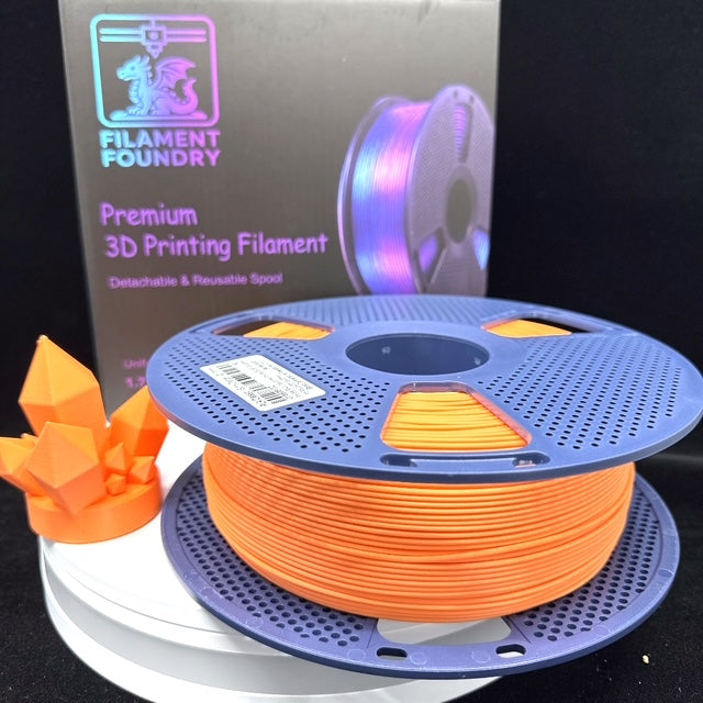 Sunny Orange PLA Classic Filament - 1.75mm 1kg spool with a matching crystal sample print and Filament Foundry packaging.