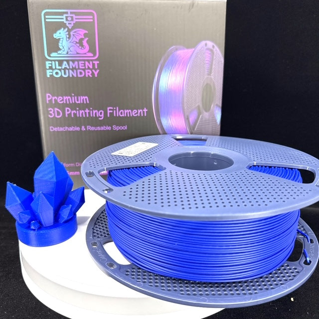 Klein Blue PLA Matte Filament - 1.75mm 1kg spool with a matching crystal sample print and Filament Foundry packaging.