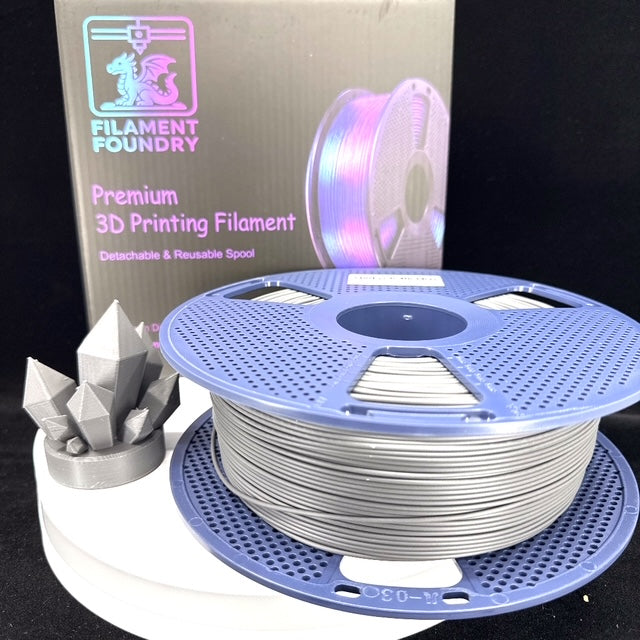 Grey PLA Classic Filament - 1.75mm 1kg spool with a matching crystal sample print and Filament Foundry packaging.